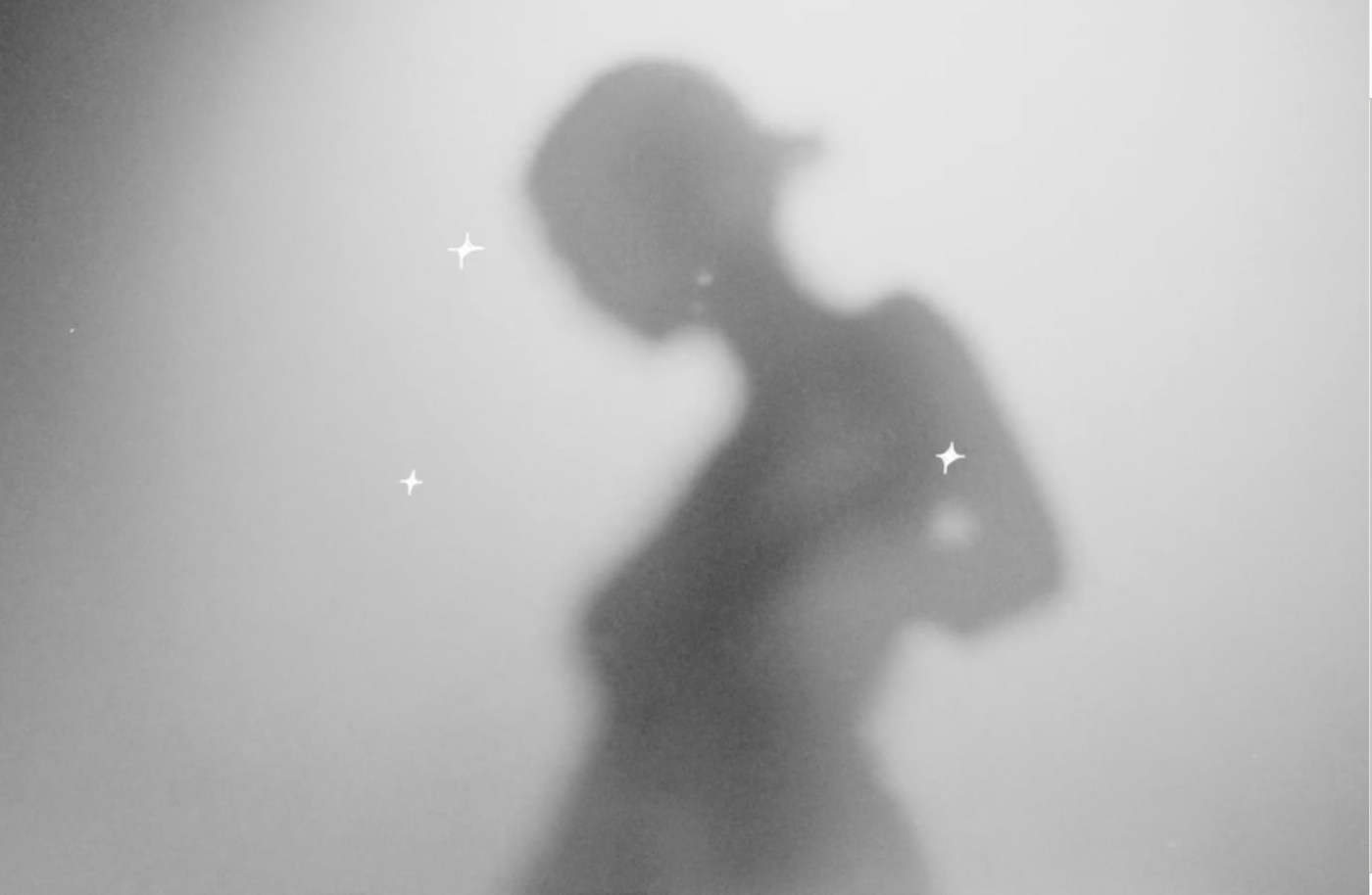 silhouette of a girl with sparkles